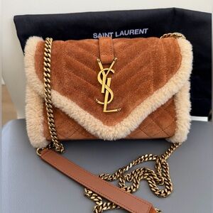 SAINT LAURENT
Envelope small shearling-suede shoulder bag